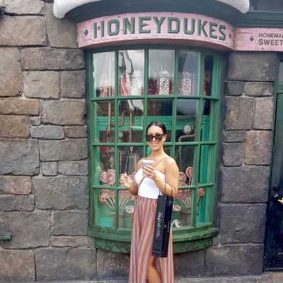 Enjoying a Butterbeer outside Honeydukes in the Wizarding World of Harry Potter!
